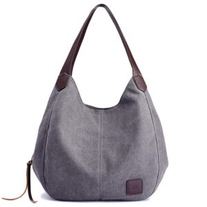 Graue Handtasche aus Textil mit braunen Griffen und Lederdetails.