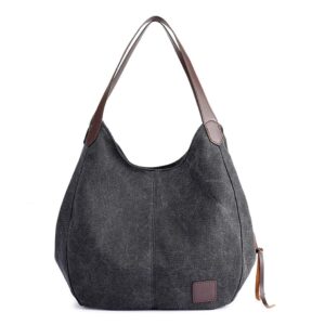 Graue Stofftasche mit braunen Ledergriffen vor weißem Hintergrund.