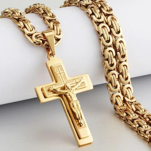 Goldene Kette mit Kreuzanhänger und detaillierter Jesusfigur. Goldene Kette mit Kreuzanhänger und detaillierter Jesusfigur.