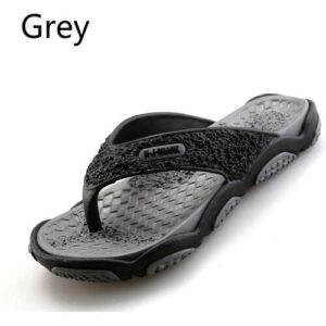 Graue Flip-Flop-Sandale mit strukturiertem Muster.