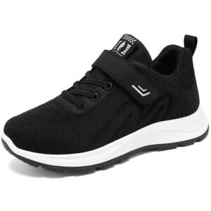 Schwarzer Sneaker mit weißer Sohle und Klettverschluss, seitlich fotografiert.