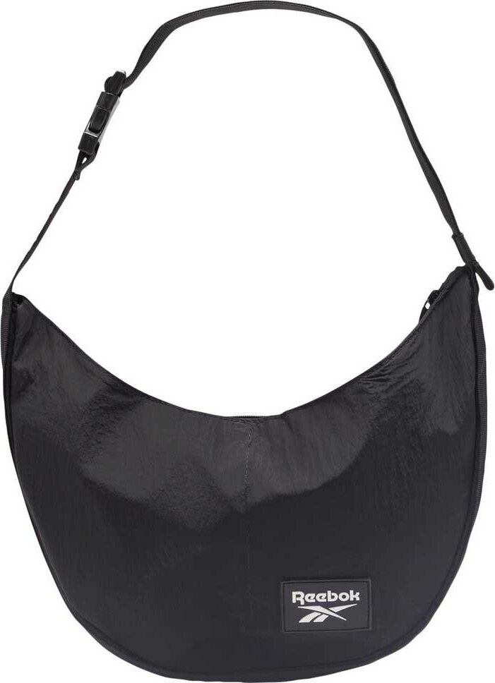 Schwarze Schultertasche von Reebok mit breitem Schulterriemen und Logoaufdruck. Schwarze Schultertasche von Reebok mit breitem Schulterriemen und Logoaufdruck.